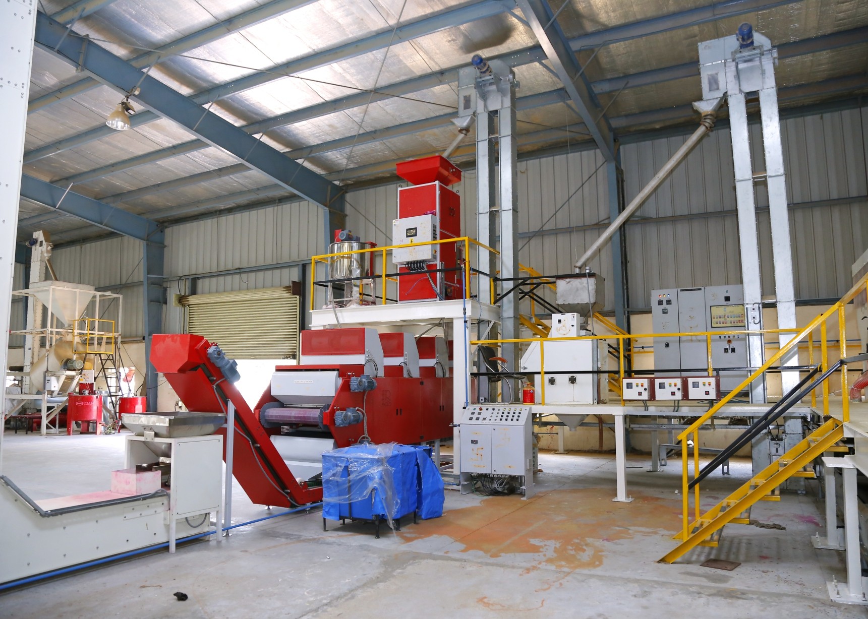 Seed treatment and elevator conveyors